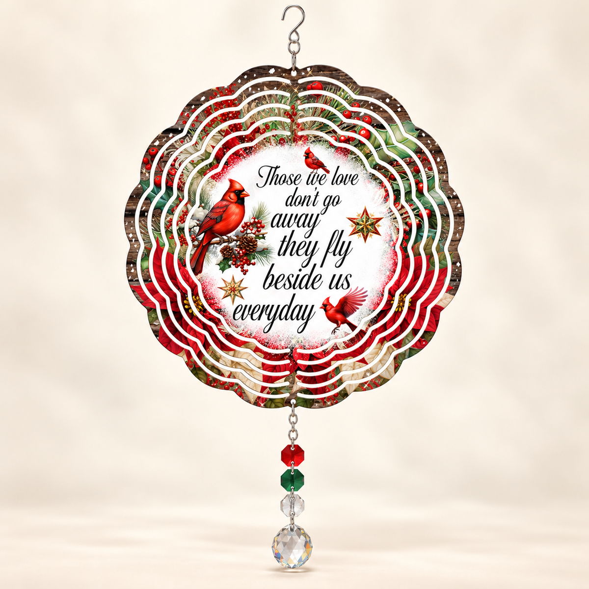 Illustrative front mockup of Those We Love cardinal memorial 8-inch wind spinner with example red green and clear prisms