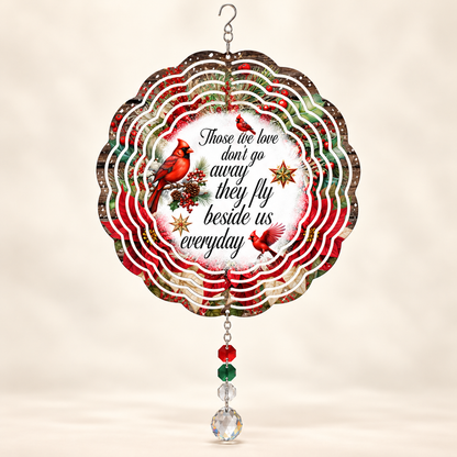 Illustrative front mockup of Those We Love cardinal memorial 8-inch wind spinner with example red green and clear prisms