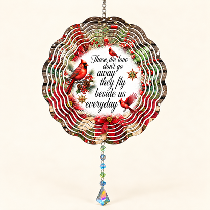 Those We Love cardinal and poinsettia memorial wind spinner on cream, illustrative front mockup